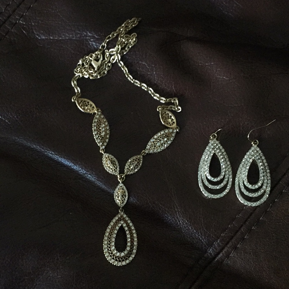 Brand new gold and diamond looking necklace and earrings